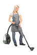 Photo: Female cleaning with vacuum cleaner Female cleaning with vacuum cleaner
