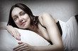 portrait of  brunette sexy woman in bed