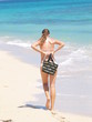 Girl walking on the beach Girl walking on the beach