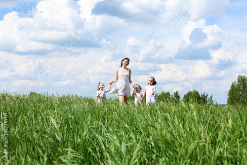 Photo: family with children in summer day outdoors family with children in summer day outdoors
