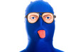 Blue faced man with weird eyes and tongue sticking out
