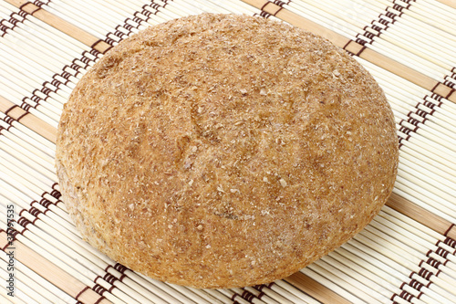 Photo: Bread close-up on a wooden background Bread close-up on a wooden background