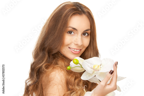 Foto: beautiful woman with orchid flower beautiful woman with orchid flower
