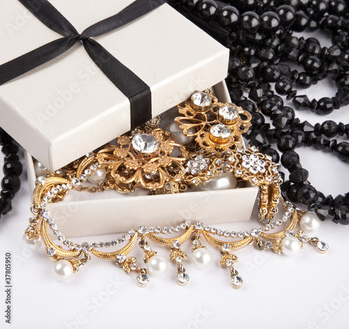 Photo: Golden jewelry in open box Golden jewelry in open box