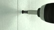 Driving a screw into drywall