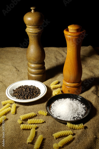 Photo: Salt and Pepper Grinders With Some Fusilli Pasta Salt and Pepper Grinders With Some Fusilli Pasta