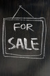 For sale - text written on blackboard