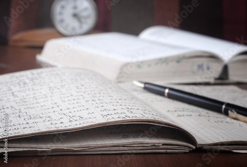 Photo: books and volumes on the table books and volumes on the table
