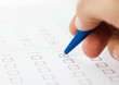 Close up of human hand filling job application