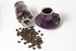fresh dark coffee beans with bottle and cup