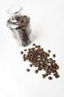 fresh dark coffee beans with bottle