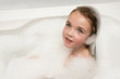 Foto: Little girl in soap foam Little girl in soap foam