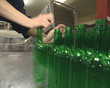 Worker packingt PET bottles. Plastics recycling.
