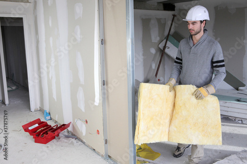 Photo: Man building partition Man building partition