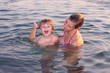 Mother and her daughter on the sea