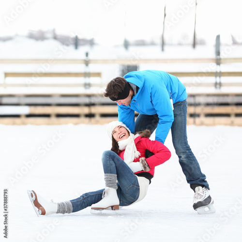 Photo: Ice skating rink couple winter fun Ice skating rink couple winter fun