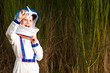 Foto: Young boy in an astronaut suit playing with toy airplane Young boy in an astronaut suit playing with toy airplane
