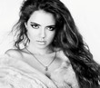 Attractive model with shiny volume curly hair.