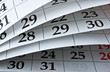 Closeup calendar page with drawing-pins