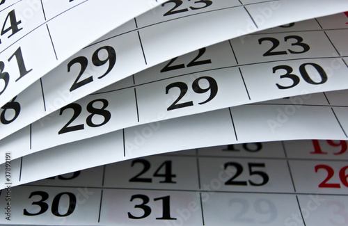 Photo: Closeup calendar page with drawing-pins Closeup calendar page with drawing-pins