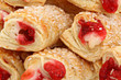 Photo: Close up Raspberry Filled Pastries with Sprinkles Close up Raspberry Filled Pastries with Sprinkles
