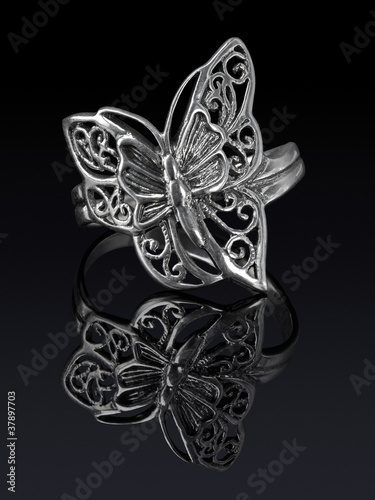 Photo: Silver ring butterfly shaped with reflection. Silver ring butterfly shaped with reflection.