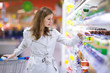 Beautiful young woman shopping for fruits and vegetables
