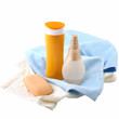 sunscreen cream and bath towel isolated on white
