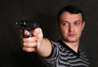 Photo: Man with a pistol Man with a pistol