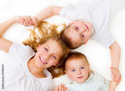 Photo: Happy Family. Kids over white background Happy Family. Kids over white background