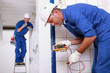 Two electrical inspectors on work site