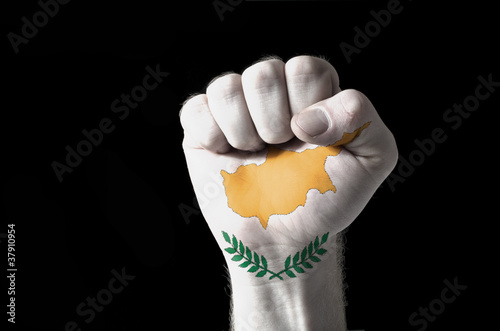 Photo: Fist painted in colors of cyprus flag Fist painted in colors of cyprus flag