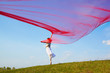 beautiful hippie girl with red fabric