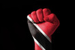 Fist painted in colors of trinidad tobago flag Fist painted in colors of trinidad tobago flag