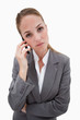 Bored looking bank employee on her cellphone