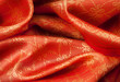 Folded fabric with ornament