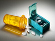 Photo: Cutting prescription pills in half to save money Cutting prescription pills in half to save money