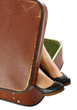 Female feet in suitcase