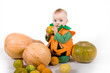 Baby in a Halloween pumpkin costume