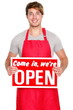 Business shop owner showing open sign