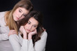 Young woman trying to comfort her friend