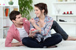 couple eating cake in bed