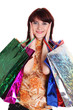 Beautiful happy woman with shopping bags isolated