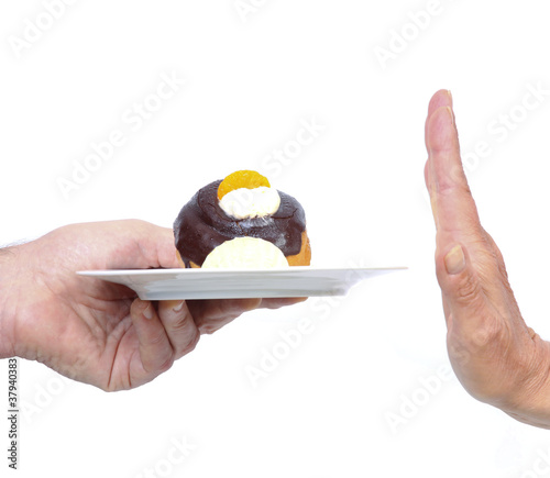 Photo: Hand refuses cake Hand refuses cake
