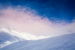 Panorama of sunrise over winter mountains