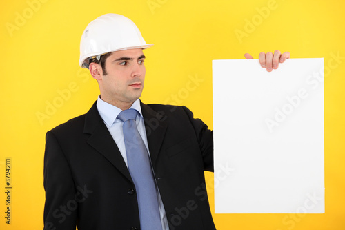 Photo: Engineer holding up a blank sign Engineer holding up a blank sign