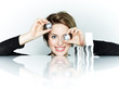 Photo: Pretty woman counting a lot of silver coins is very happy Pretty woman counting a lot of silver coins is very happy