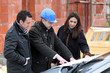 Architect reviewing a building plan with his clients