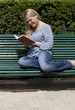 happy young woman reading a book