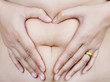 Photo: Stomach fat female body part to heart symbol. Stomach fat female body part to heart symbol.
